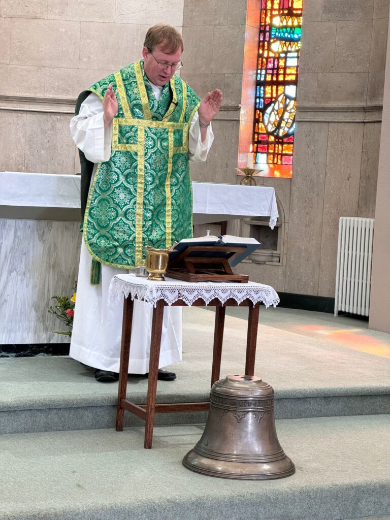 Fr Matthew blesses the new bell